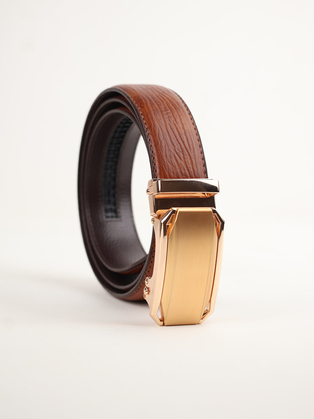 Tan belt with a gold buckle 